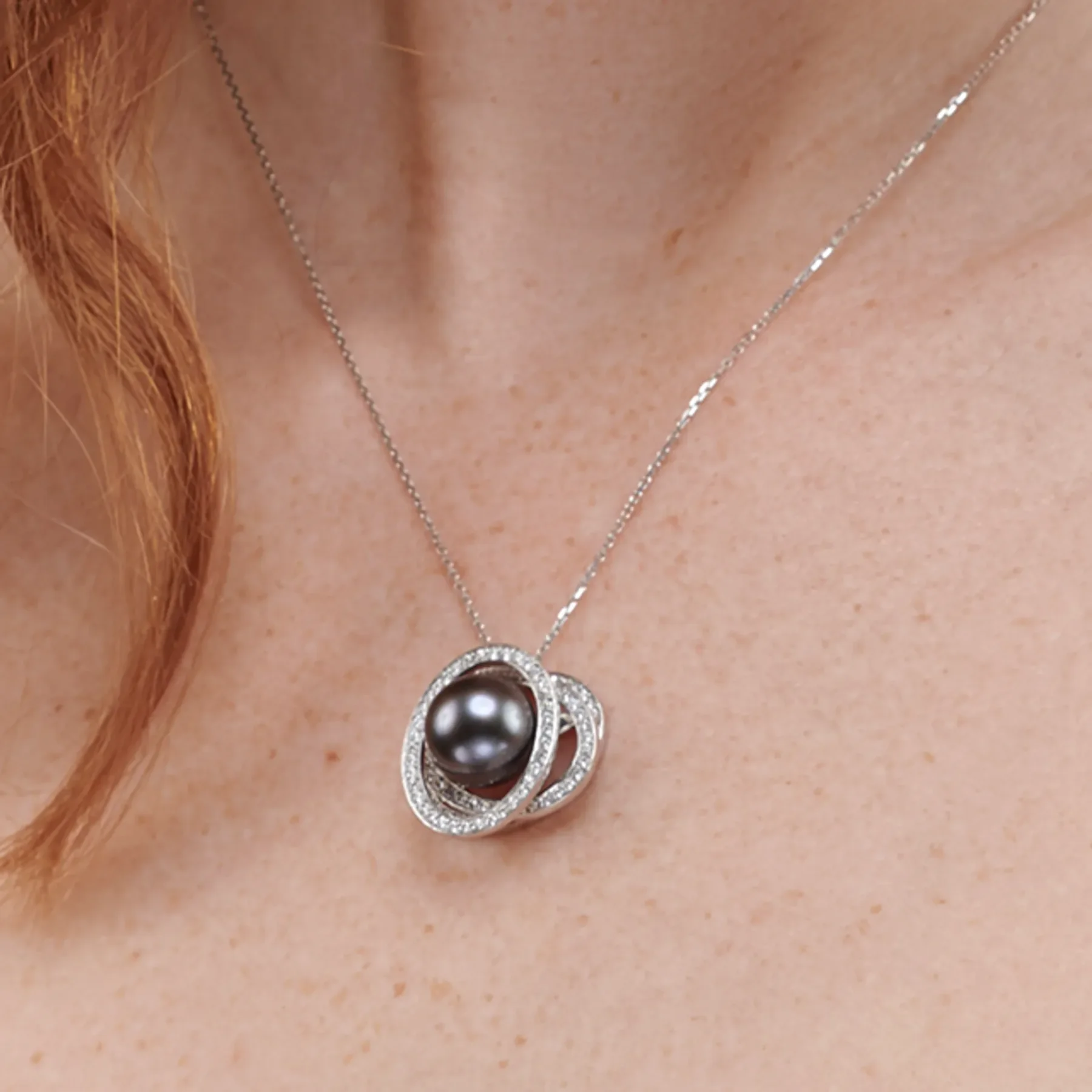 Close up image of the Tahitian Pearl Gravity Pendant with Diamonds designed by Patrice Fabre worn by@lucy.m.w