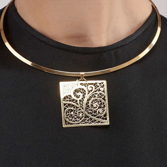 Close up of Diamond Volute Lace Pendant